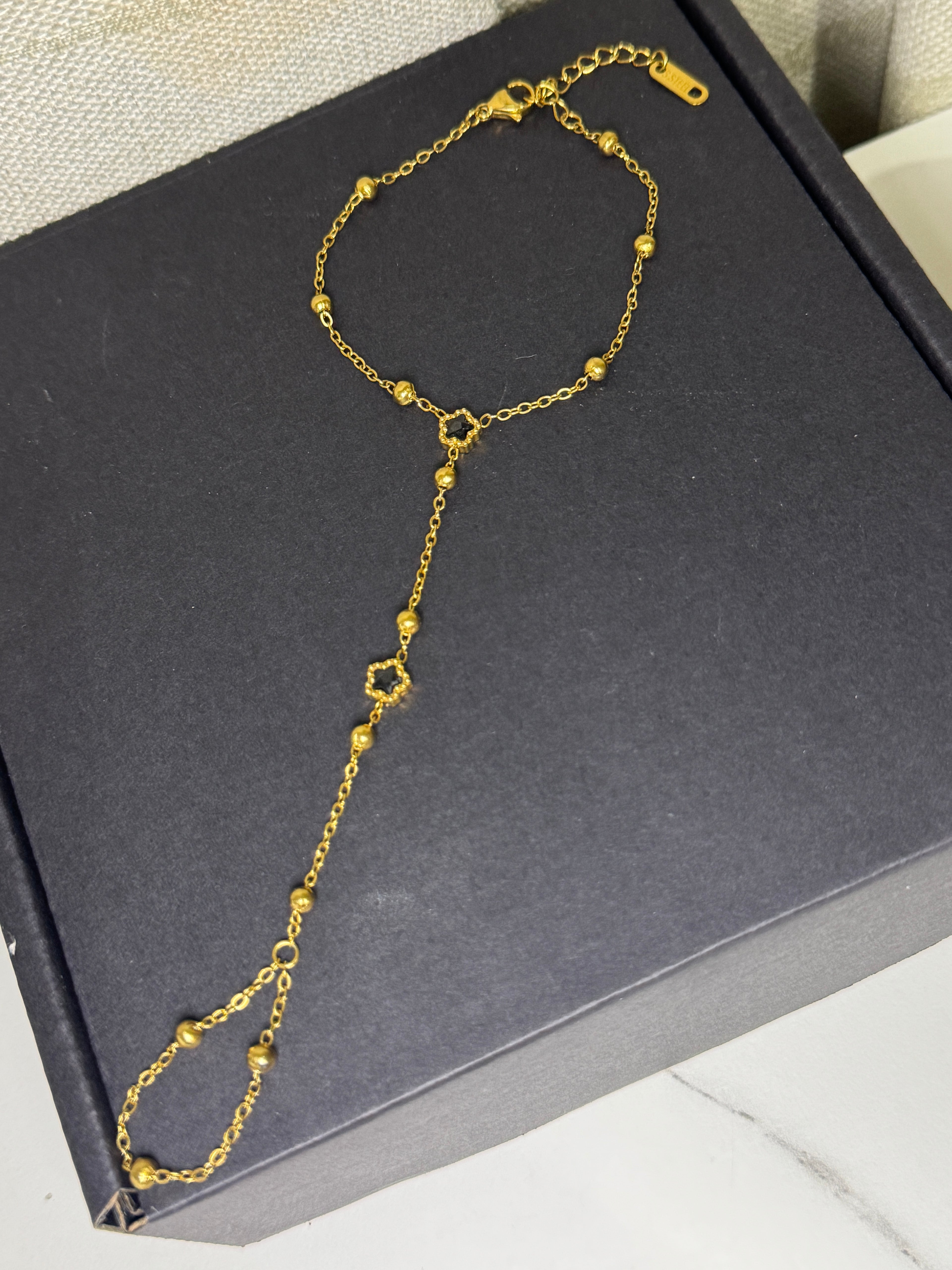 Golden Lily – Hand Chain Noir Blossom